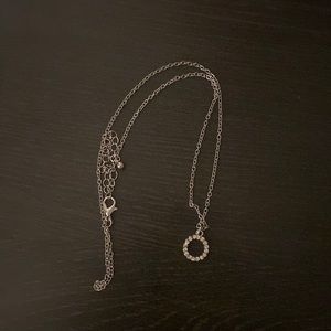 Circle diamond necklace.